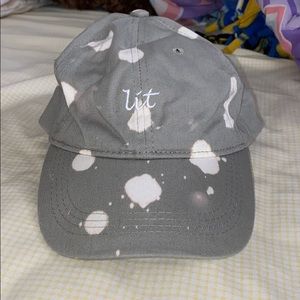 Gray “Lit” adjustable strapback cap.